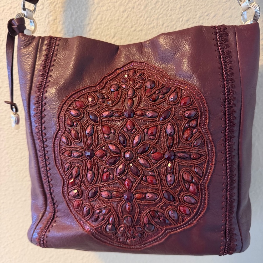 BRIGHTON ANJULINA BEADED SOFT BUCKET HANDBAG CROSSBODY IN THE COLOR MERLOT